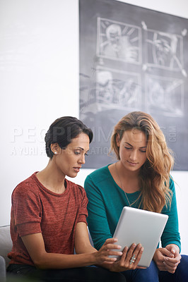 Buy stock photo Women, sofa and tablet in office with discussion for feedback, creative startup or project research. Employees, communication and technology with teamwork for brainstorming, planning or collaboration