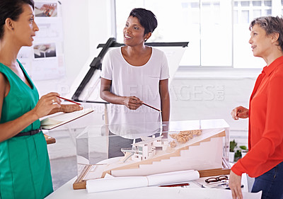 Buy stock photo Talking, floor plan or engineering team drawing for development project and planning on paper. Architecture, women or group of designers with collaboration for sketching blueprint of office building