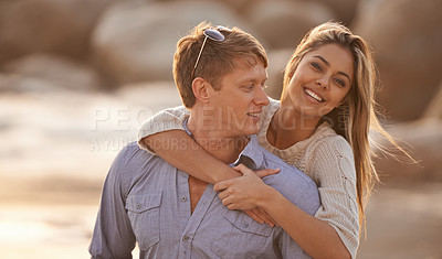 Buy stock photo Couple, portrait and embrace for love by water, ocean wave and peace for romance in relationship. Happy people, smile and security in marriage, hug and travel together on vacation or holiday for date