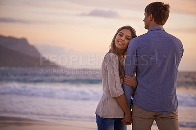 Buy stock photo Couple, holding hands and portrait in embrace by water, ocean and peace for romance in relationship. People, love and security in marriage, sea and travel together on vacation or holiday for date