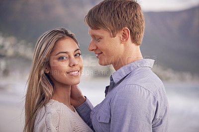 Buy stock photo Couple, portrait and love in touch by beach, ocean waves and peace for romance in relationship. People, affection and security in marriage, sea and travel together on vacation or holiday for date