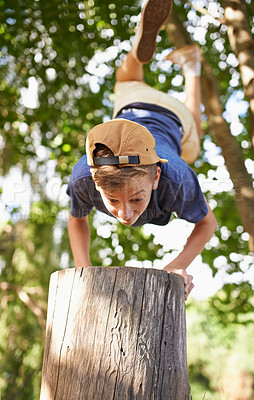 Buy stock photo Boy, outdoor and nature or forest with handstand for fun or adventure with physical activity for youth. Teenager, cartwheel and balance on tree branch in wilderness for exercise, strength and health.