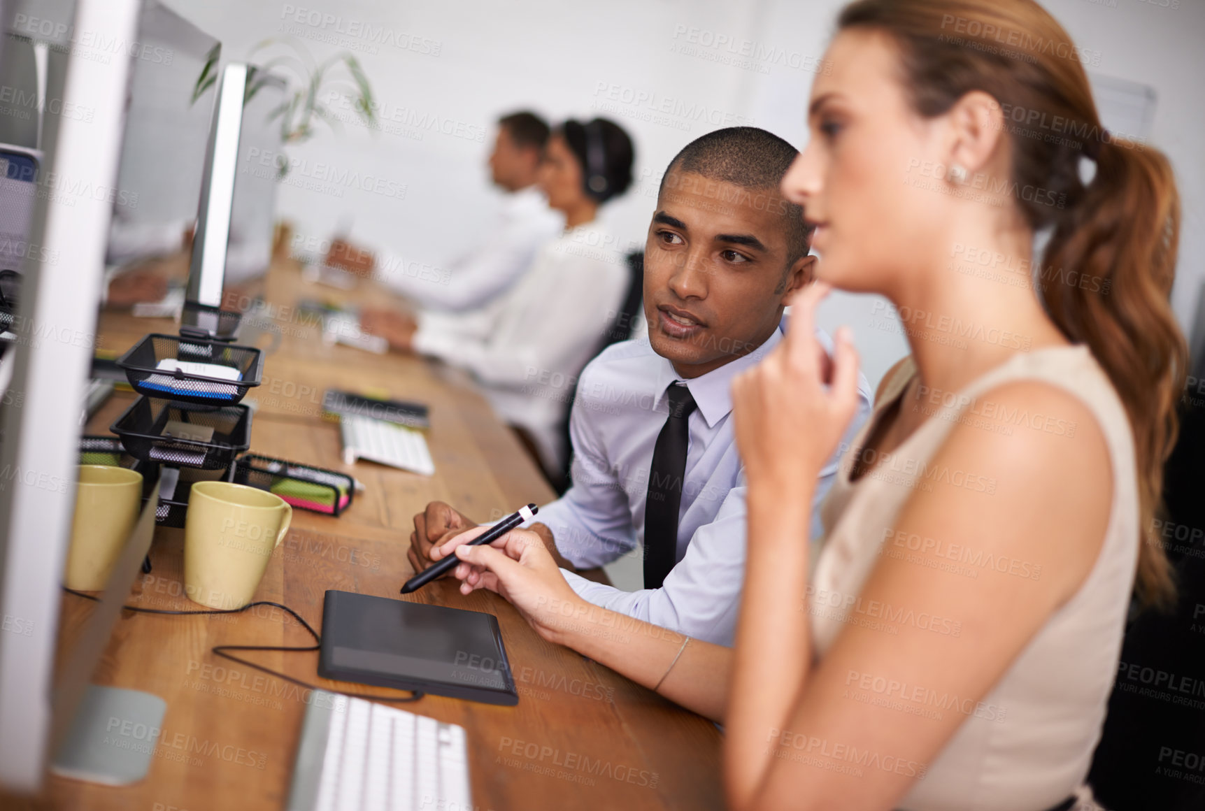 Buy stock photo Business people, meeting and thinking with designer on computer for digital design or development at office. Young man, woman or creative employees working on desktop PC for project, tasks or startup