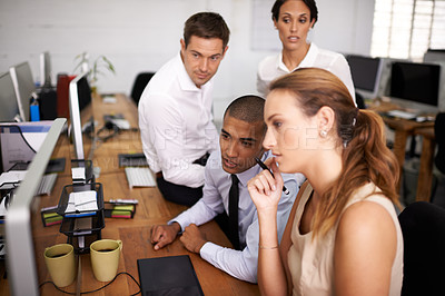 Buy stock photo Shot of a business team working on a project together in the office
