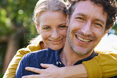 Buy stock photo Cropped shot of an affectionate husband and wife standing outdoors