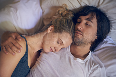 Buy stock photo Cropped shot of a young woman sleeping on her boyfriend's shoulder in bed