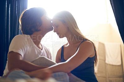 Buy stock photo Forehead, kiss and couple in a house with love, commitment or bonding, trust or relax in their home together. Peace, gratitude and people embrace in a living room with support, security or respect