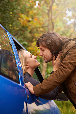 Buy stock photo Transport, travel and couple in car for goodbye, greeting and love for journey, leaving and commute. Road trip, driving and man and woman in vehicle window for bonding, relationship and embrace