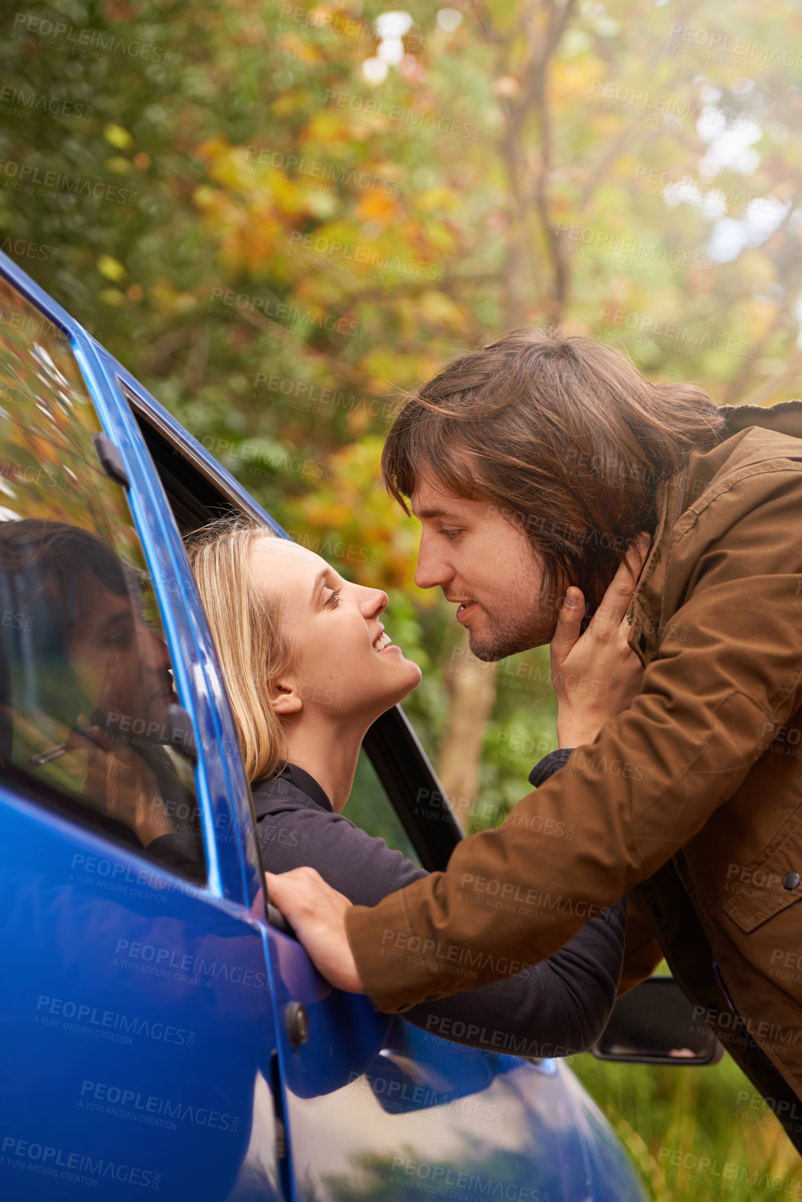 Buy stock photo Transport, travel and couple in car for goodbye, greeting and love for journey, leaving and commute. Road trip, driving and man and woman in vehicle window for bonding, relationship and embrace