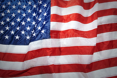 Buy stock photo Closeup of the american flag blowing in the wind. Freedom and patriotism for the american people. Celebrating independence on the fourth of July. The stars and stripes show pride in your country
