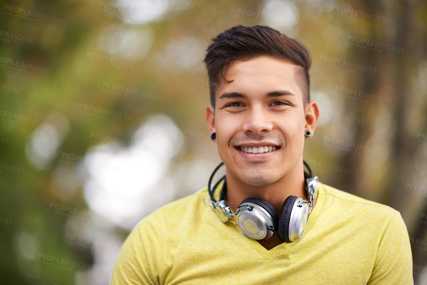 Buy stock photo Smile, portrait and young man in nature by outdoor park, field or garden for fresh air. Happy, gen z and face of cool male person from Mexico with positive, good and confident attitude for style.