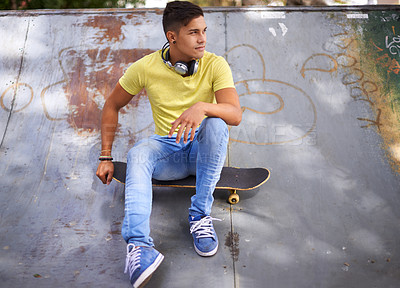 Buy stock photo Skateboard, thinking and teenager in skate park for training, exercise and skating in city. Skater, fashion and young man in trendy, casual outfit and street style for sports, fun hobby and fitness