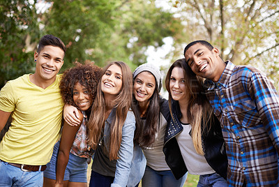 Buy stock photo Portrait of a group of young friends standing together outside