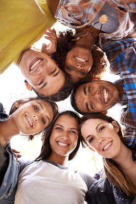 Buy stock photo Happy, portrait and low angle of friends in circle with diversity, unity and collaboration. Teamwork, smile and group of multiracial people in huddle together for solidarity, community and friendship