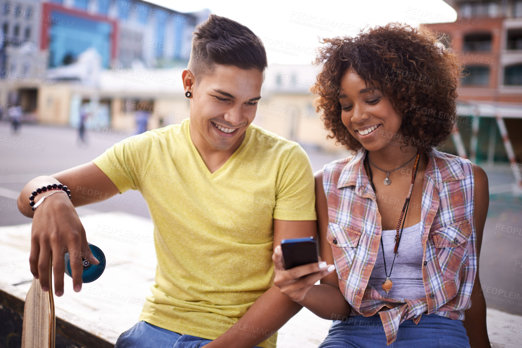Buy stock photo Happy, phone and couple with skateboard in city for exercise, training and sports hobby in town. Skate park, fashion and man and woman on smartphone for social media, networking and online chat
