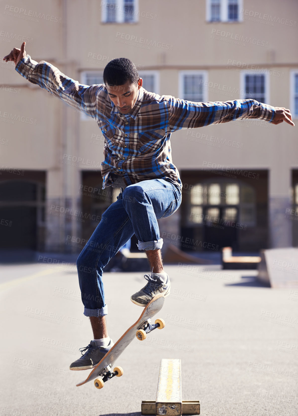 Buy stock photo Man, skateboard and jump at urban skate park, sports and energy with skill, stunt and recreation activity outdoor. Skateboarder, confidence and trick, training and workout for balance and exercise