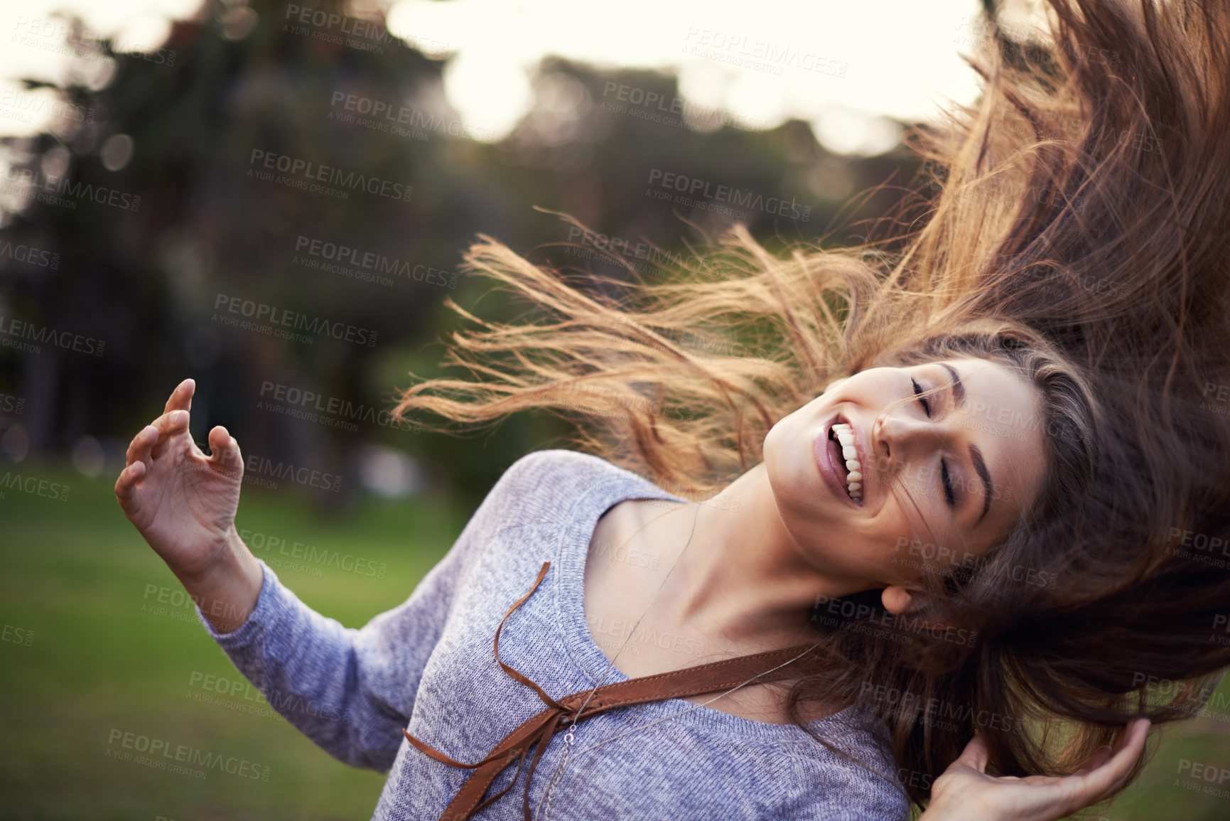 Buy stock photo Woman, happy and dancing with hair in wind, female person in nature with carefree creative and moving motion. Summer, enjoy or student on holiday with excited, head and smile for vacation freedom