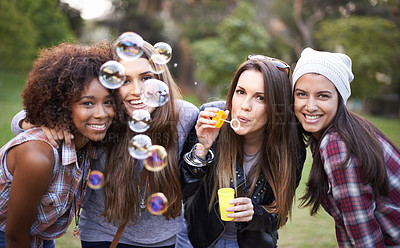 Buy stock photo Friends, bubbles and portrait of women in park for bonding, relationship and happiness outdoors. Happy, fashion and people with soap bubble in nature for weekend, holiday and vacation together