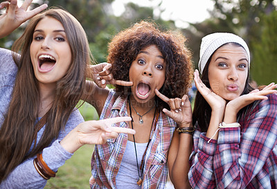 Buy stock photo Funny face, portrait and friends in a park with silly, fun or bonding on vacation, weekend or reunion in nature. Crazy, expression and gen z women in a forest with goofy, comic or joke and gesture