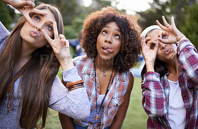 Buy stock photo Funny, face and friends in a park with silly, fun or bonding on vacation, weekend or reunion in nature. Crazy, expression and gen z women in a forest with goofy, comic or personality, joke or gesture