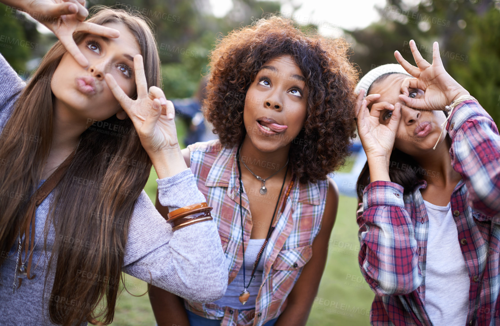 Buy stock photo Funny, face and friends in a park with silly, fun or bonding on vacation, weekend or reunion in nature. Crazy, expression and gen z women in a forest with goofy, comic or personality, joke or gesture
