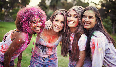 Buy stock photo Friends, group hug and color festival in park, fun with powder paint for celebration or party outdoor. Portrait, bonding and colorful mess in nature, smile and culture with women at summer event