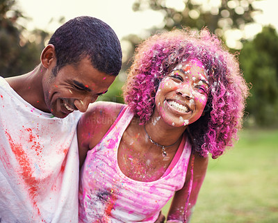 Buy stock photo Happy, powder paint and couple of friends outdoor with Holi festival and colorful event with smile. Celebration, love and excited in nature with African people and crazy color dust for party together