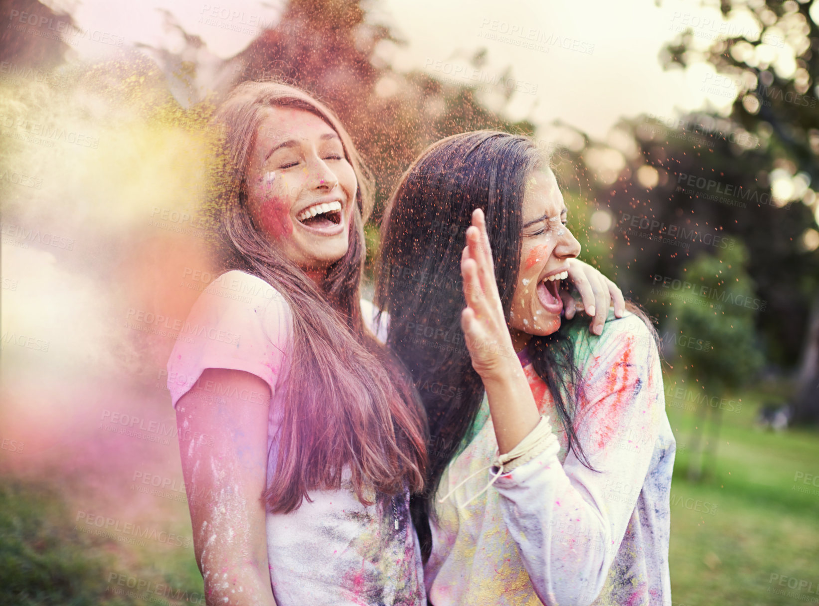 Buy stock photo Happy, powder paint and girl friends laugh outdoor with Holi festival and colorful event with smile. Celebration, love and excited in nature with young people and crazy color dust for party together