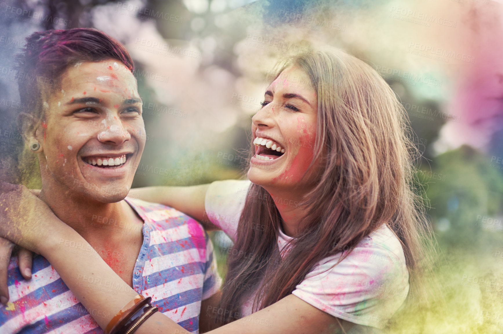 Buy stock photo Happy, powder paint and couple of friends laugh outdoor with Holi festival and colorful event with smile. Celebration, hug and excited in nature with hipster people and crazy fun dust for party