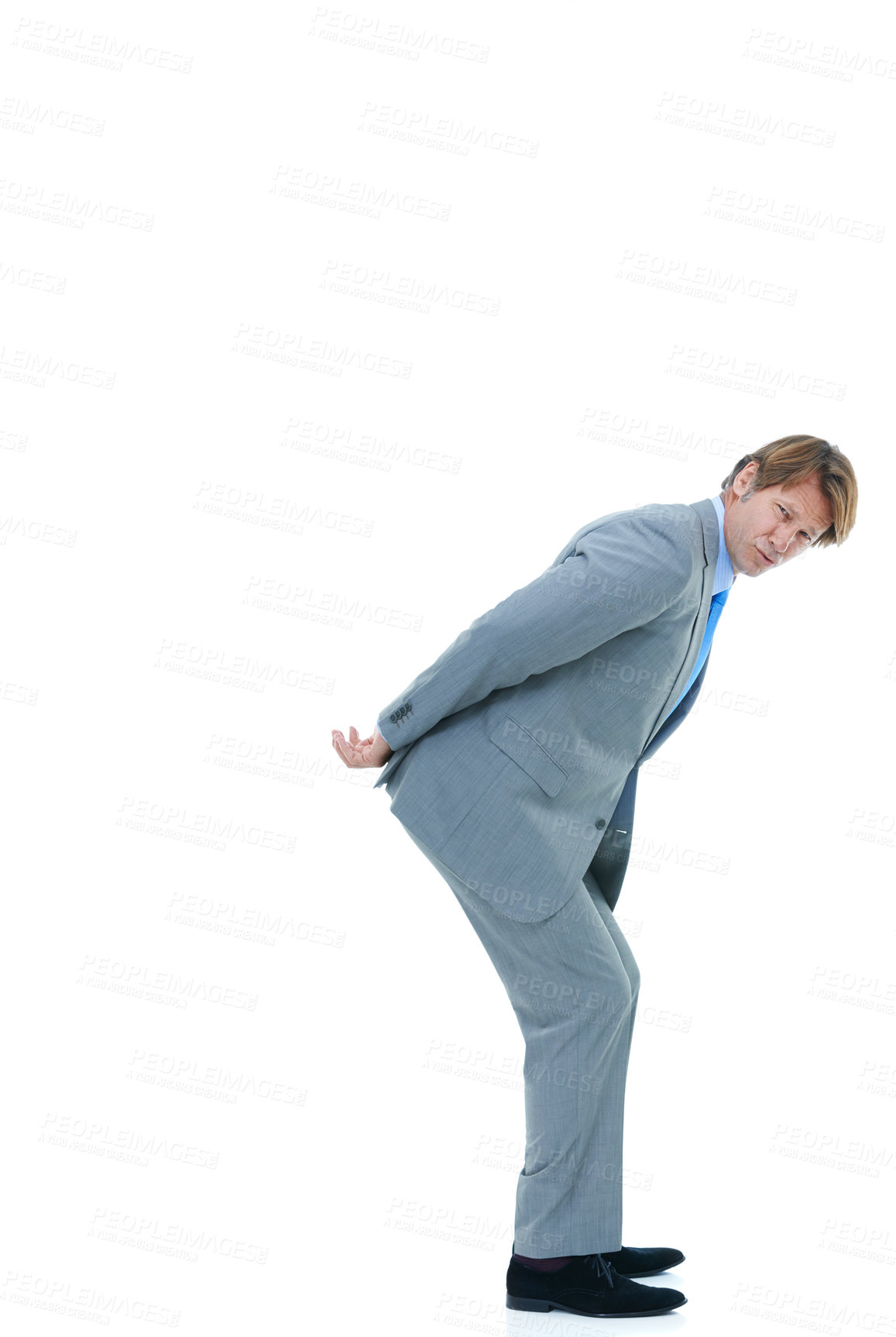Buy stock photo Businessman, portrait and back with pressure, workload or carrying invisible weight on a white studio background. Isolated man, employee or model holding something heavy for business on mockup space