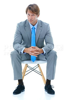 Buy stock photo Confident businessman, sitting and studio portrait with ambition in corporate career and professional in suit. Attorney, decision and face in chair for job satisfaction and pride by white background