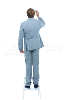 Buy stock photo Rear view of a businessman writing on a wall