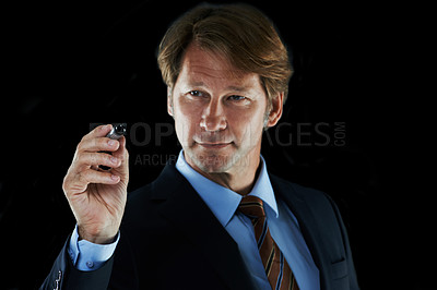Buy stock photo Cropped shot of a businessman holding a marker pen