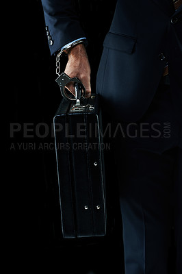 Buy stock photo Shot of an unrecognizable businessman with a briefcase handcuffed to his wrist