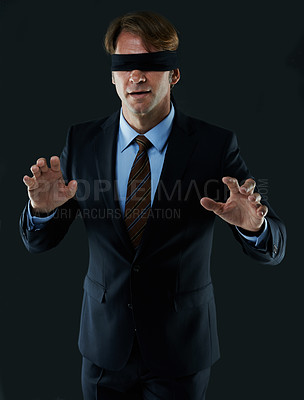 Buy stock photo Cropped shot of a blindfolded businessman