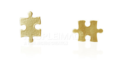 Buy stock photo Shot of a two puzzle pieces against a white background