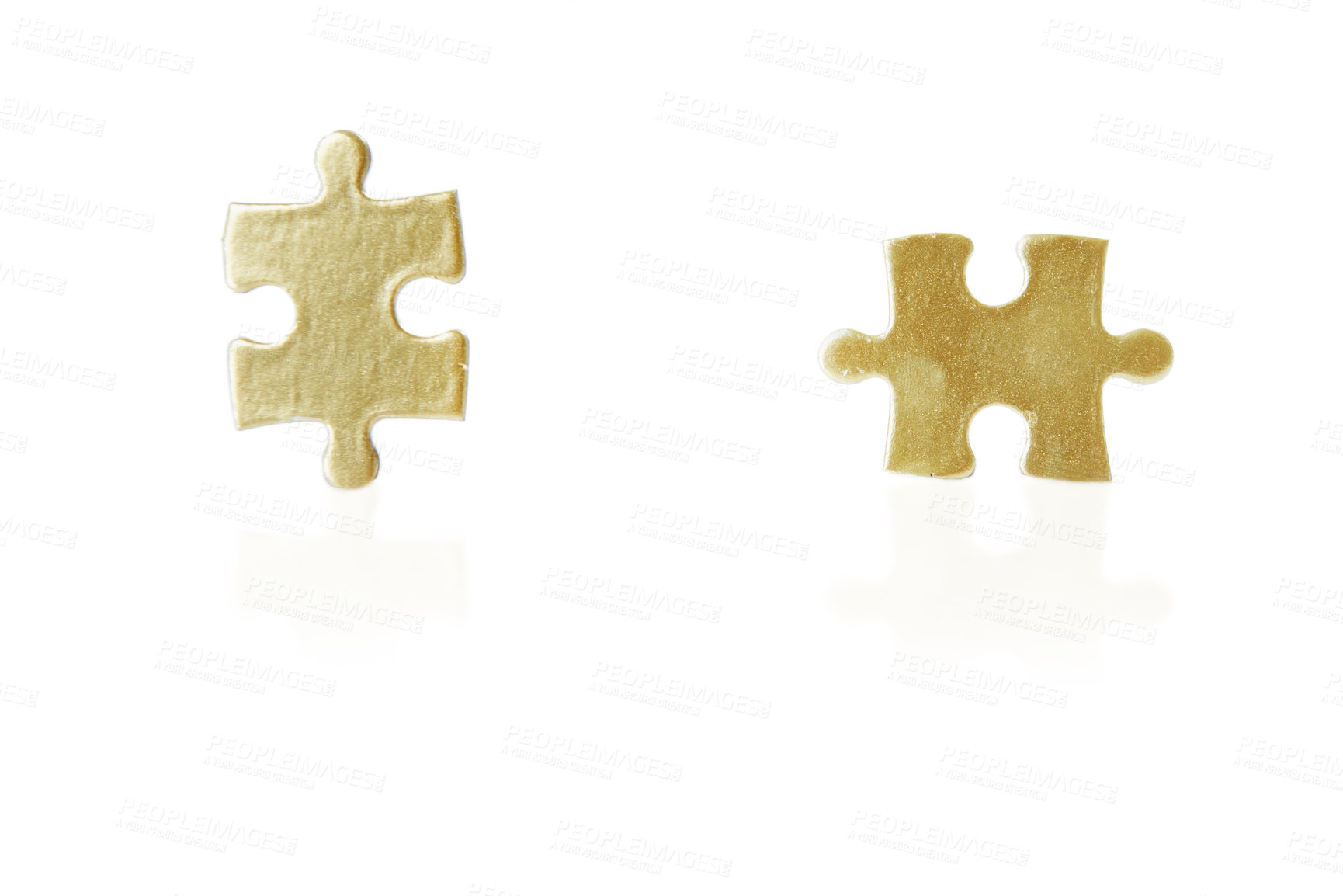 Buy stock photo Shot of a two puzzle pieces against a white background