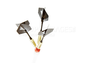 Buy stock photo Darts, bullseye and target with marker for mission, goal or accuracy on a white studio background. Closeup of sports equipment, good aim or skill in activity or game of marksmanship on mockup space