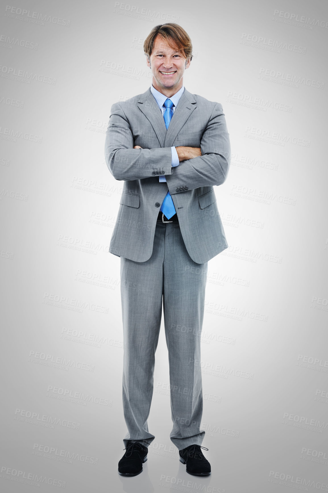 Buy stock photo Happy, businessman and portrait with confidence for career ambition or professional job on a gray studio background. Man or employee with smile and arms crossed for fashion or style on mockup space