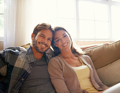 Buy stock photo Smile, portrait and couple on sofa with love, relax and weekend at home together. Romance, man and woman on couch with care, marriage and happy relationship with embrace, support and living room
