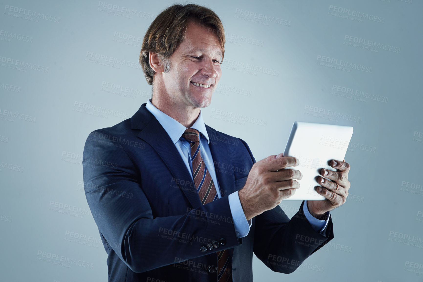 Buy stock photo Happy, businessman and tablet for communication, information technology and working in corporate career. Leadership, manager and ceo with digital pad for email, web and internet on studio background
