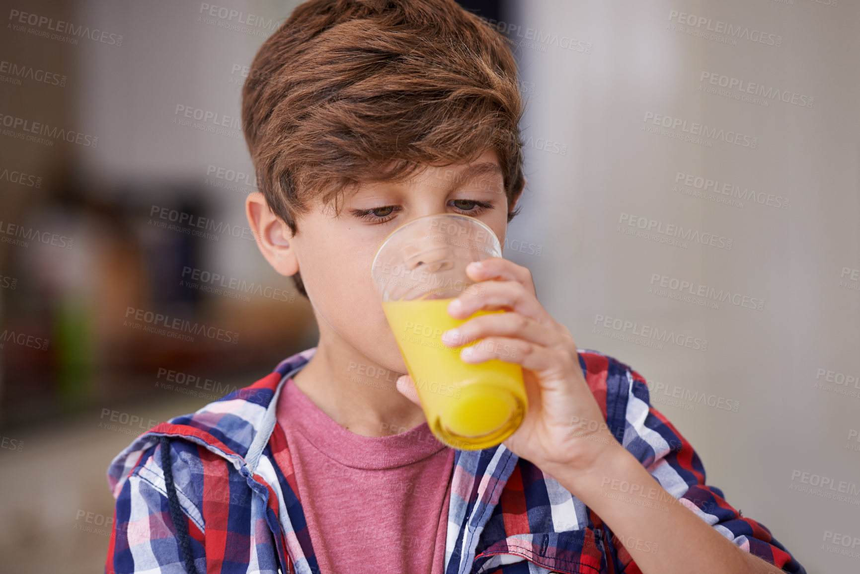 Buy stock photo Kids, kitchen and boy drinking orange juice from glass in morning for diet, health or nutrition. Breakfast, children and cup with young teen in apartment to enjoy fresh beverage for development