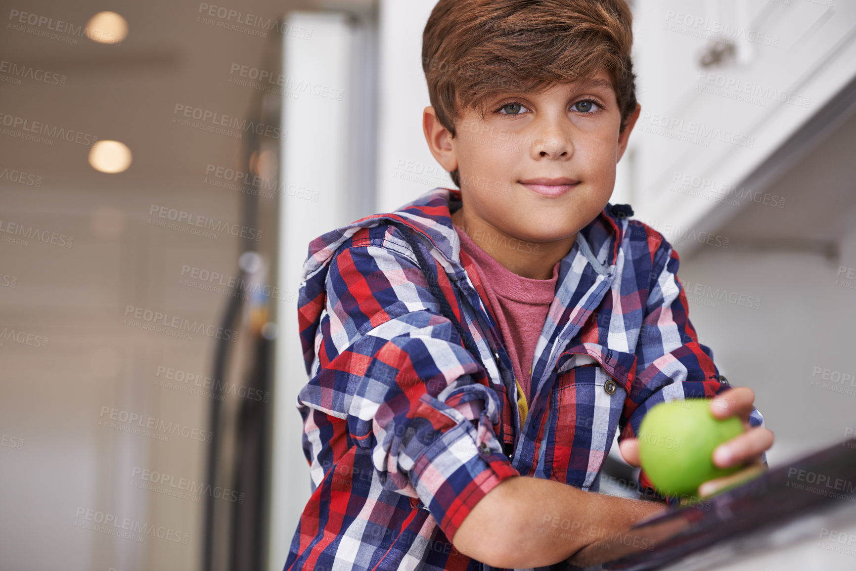 Buy stock photo Portrait, apple and boy kid in kitchen of home with food as diet, health or nutrition for development. Fruit, wellness and organic snack with confident teen child in apartment for growth or hunger
