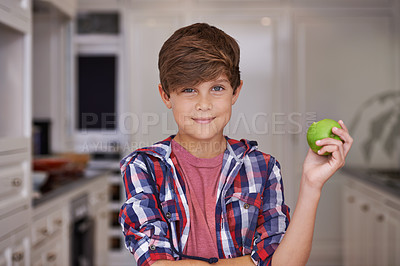 Buy stock photo Boy, smile and portrait in kitchen with apple for nutrition, breakfast and health in house for snack. Child or kid in home with fruit for vitamin, nutrient and fibre for meal, delicious and raw  