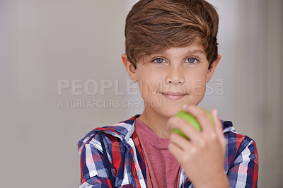 Buy stock photo Portrait, apple and boy child in home, eating green fruit as diet, health or nutrition for development. Face, food and natural with confident young teen kid holding organic produce in apartment