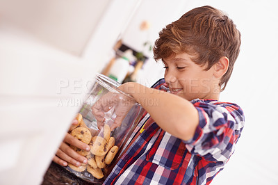 Buy stock photo Cookie, jar and child in home eating from glass, container or happy with sweets in kitchen. House, snack and kid craving a taste of sugar and excited for biscuit and unhealthy food with energy