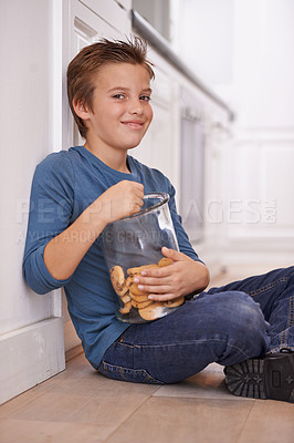 Buy stock photo Eating, cookies and portrait of child in home with glass, container or happy with jar of sweets on floor. House, kitchen and kid craving a taste of sugar with biscuit as snack and unhealthy food