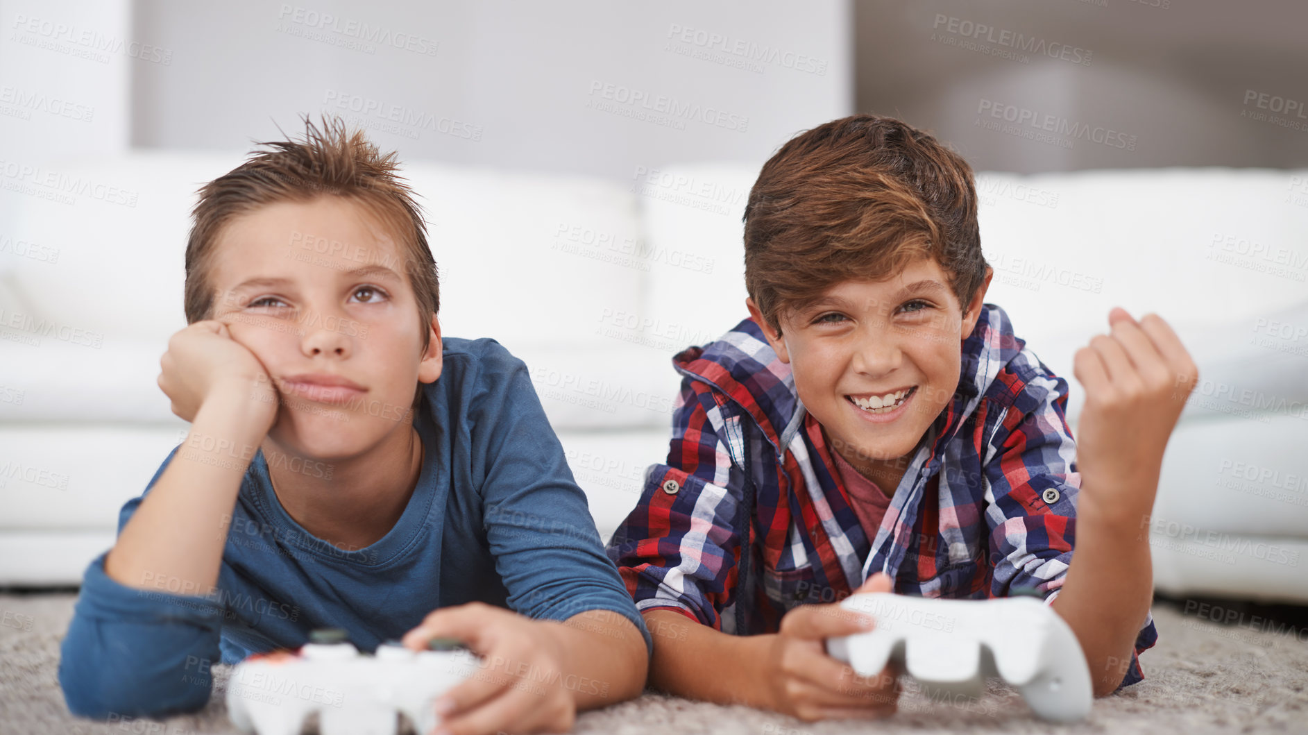 Buy stock photo Happy, children and winning a video game in home with friends in online competition for esports challenge. Excited, kid and celebration of gaming victory in contest with sad boy on floor of lounge 