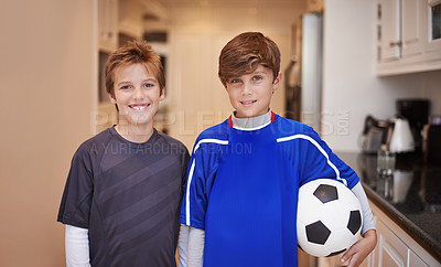 Buy stock photo Shot of two young boys with a soccer ball