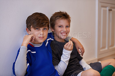 Buy stock photo Children, portrait and friends with food in sports uniform for relax break in apartment or match, training or exercise. Male people, boys and face or eating snack in house or soccer, practice or meal